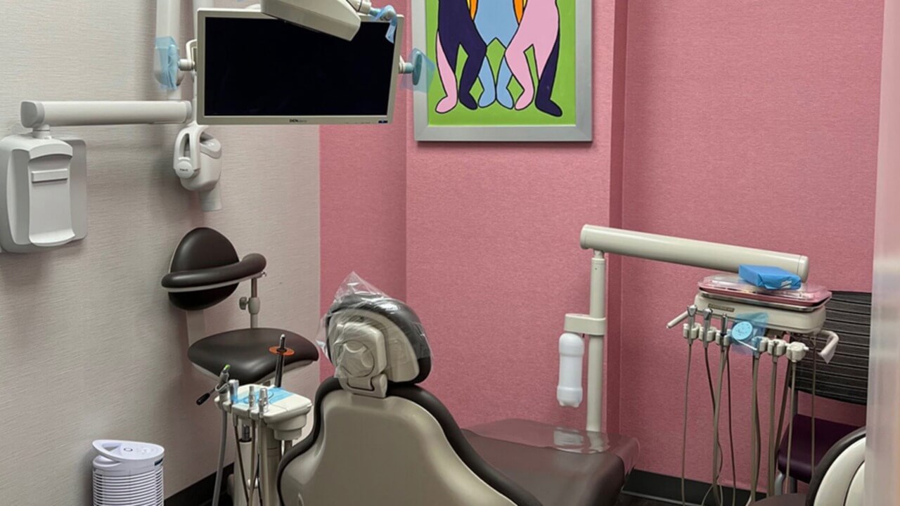 dental examination room with art and bright walls