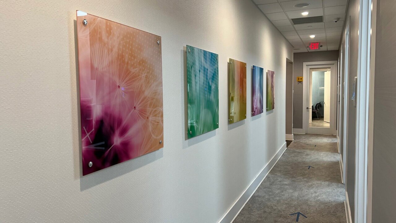 hallway in dental office lined with art