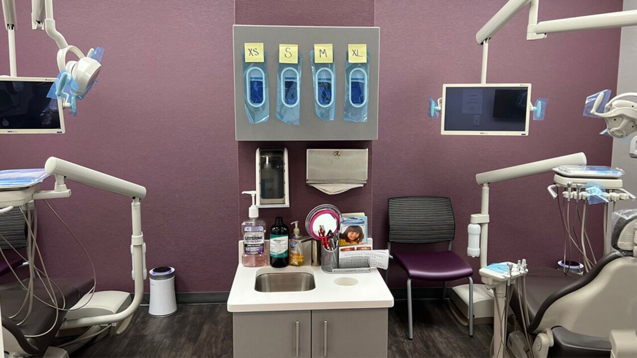 a sink between two dental exam chairs